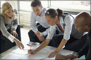 Group of people discussing the next steps of a project.